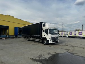 Автомобиль бортовой с тентом